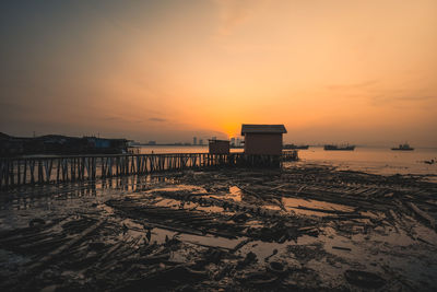 Scenic view of sea against orange sky