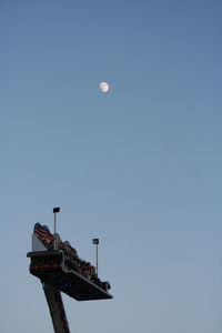 Low angle view of moon against clear sky