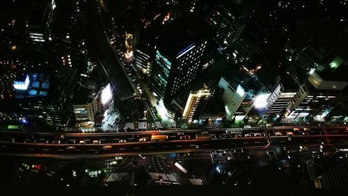 Illuminated buildings in city at night