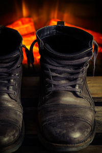 Close-up of shoes on wooden floor