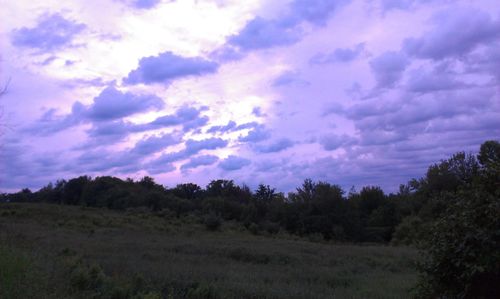 Scenic view of landscape against cloudy sky