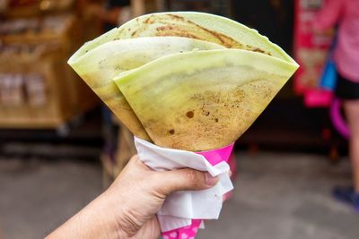 Close-up of hand holding snacks