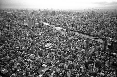 High angle view of city buildings against sky