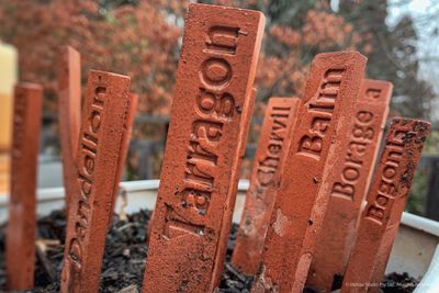 Close-up of text on metal at cemetery