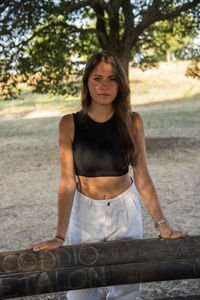 Beautiful italian girl at the park, wearing a dress