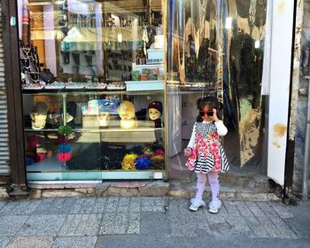 Full length of woman standing in city