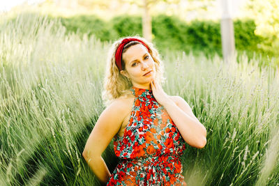 Portrait of woman standing on field