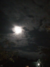 Low angle view of moon in sky at night