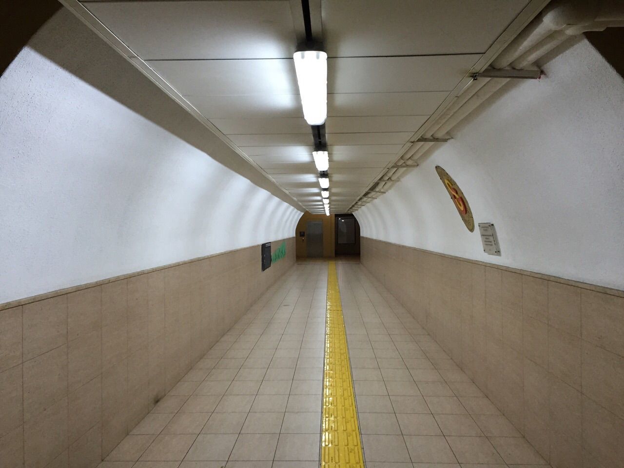 indoors, architecture, ceiling, the way forward, built structure, diminishing perspective, corridor, illuminated, vanishing point, lighting equipment, empty, tiled floor, flooring, long, in a row, wall - building feature, architectural column, building, modern, narrow