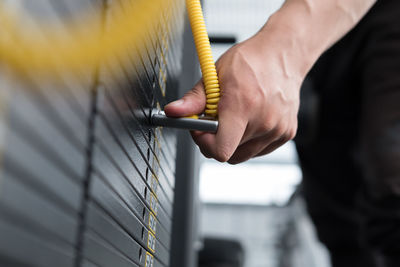 Midsection of man exercising in gym