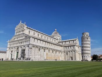 Low angle view of historical building against blue sky