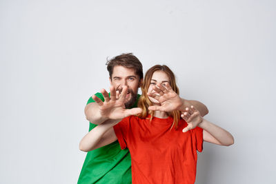 Young couple against white background