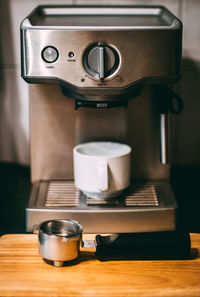 Close-up of tea cup on table at home