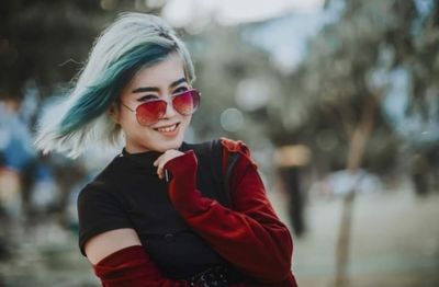 Portrait of a smiling young woman outdoors