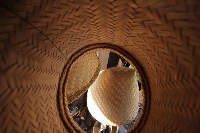 High angle view of wicker basket on ceiling