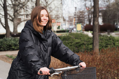 Young woman cycling in park