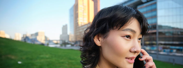 Close-up of young woman looking away