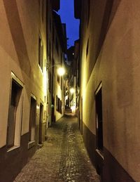 Narrow alley in city at night