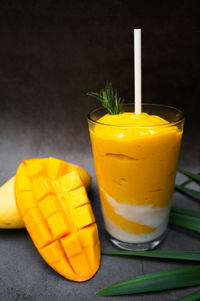 Close-up of drink mango smoothie on table