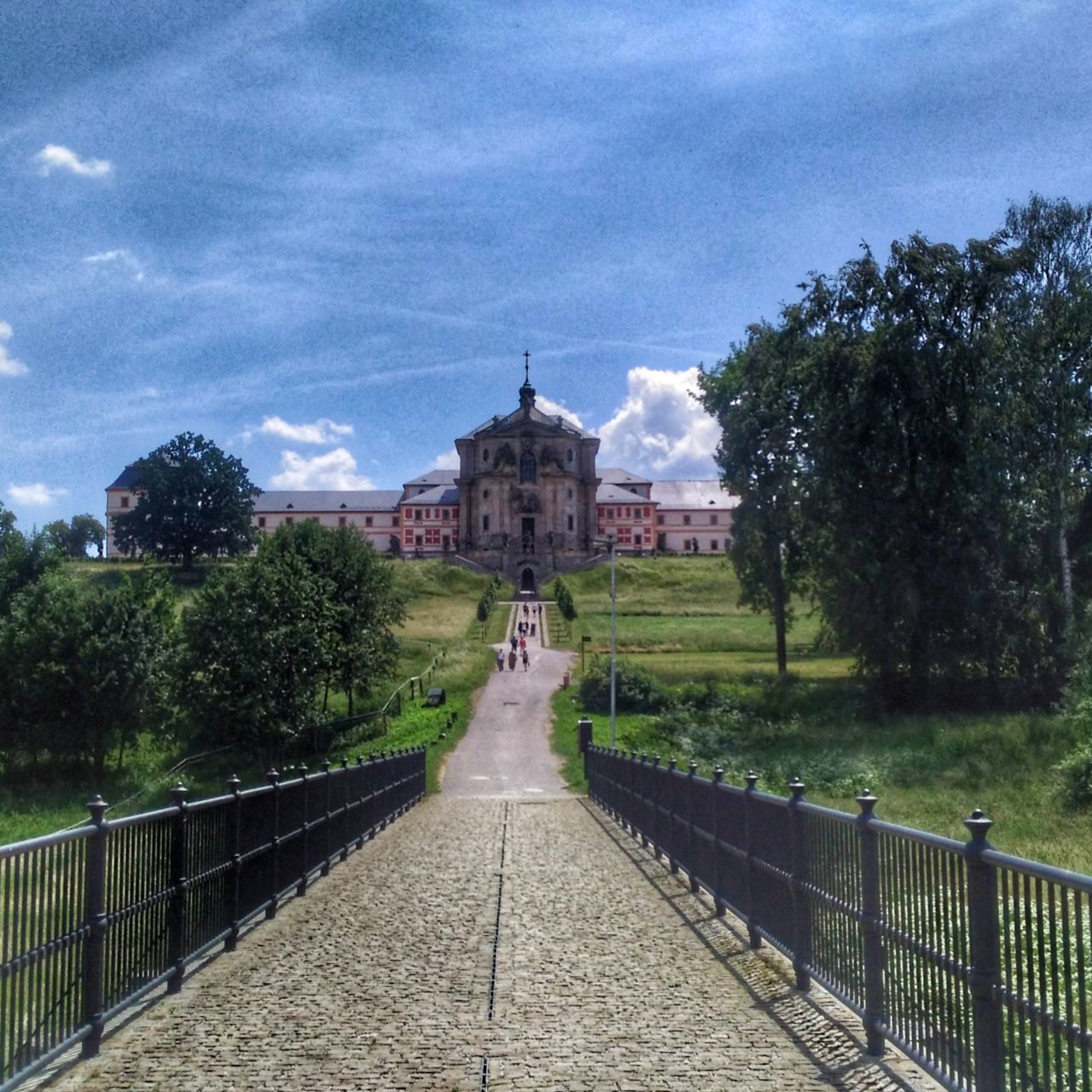 tree, architecture, plant, built structure, building exterior, sky, nature, cloud - sky, day, direction, the way forward, the past, history, railing, no people, travel destinations, barrier, footpath, travel, outdoors