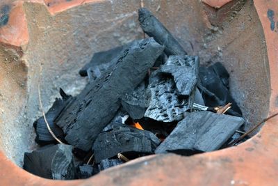 High angle view of bonfire on wood