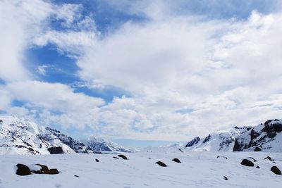 Scenic view of snowcapped mountains against sky