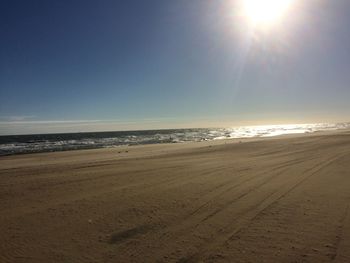 Scenic view of beach against clear sky