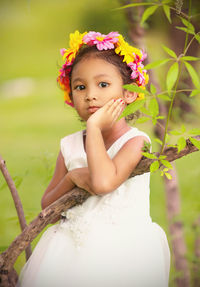 Portrait of cute girl with red flower