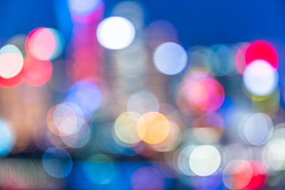 Defocused image of illuminated lights at night