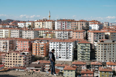 Single man in front of apartment view in ankara