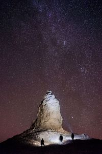 Scenic view of snow against sky at night