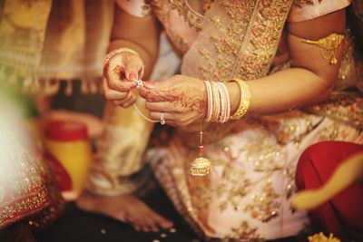 Midsection of woman with hands