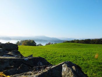 Scenic view of landscape against blue sky