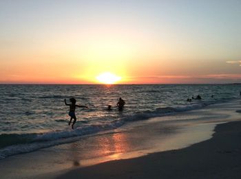 Scenic view of sea at sunset