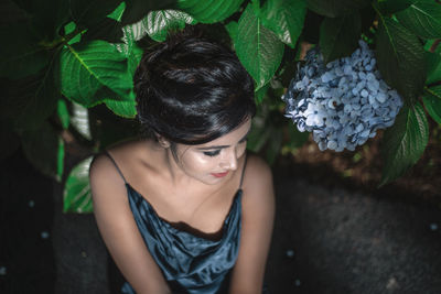 High angle portrait of woman with plants