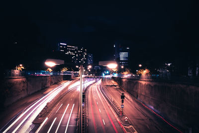 High angle view of light trails on highway at night