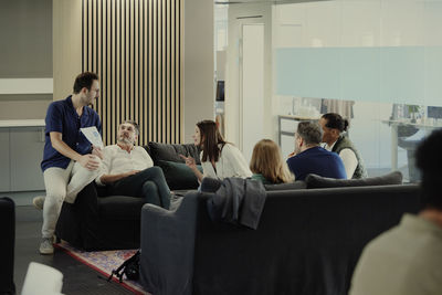 Group of business people having meeting in lobby