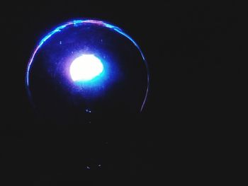 Low angle view of illuminated lights at night