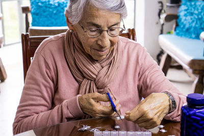 Portrait of woman sitting on table