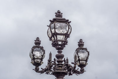 Low angle view of lamp against sky