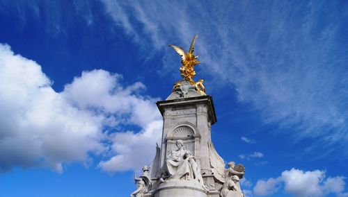 Low angle view of statue against sky