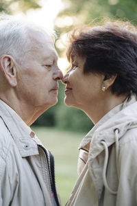 Profile of senior couple rubbing noses