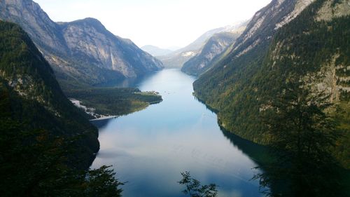 Scenic view of lake and mountains against sky