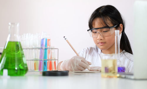 Girl experimenting at laboratory