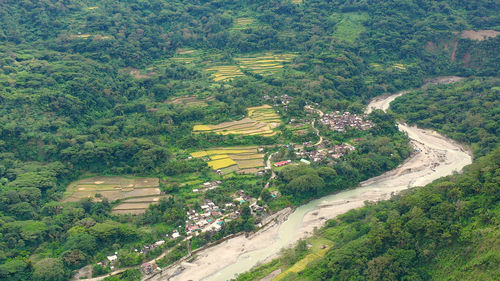 Village and river in a mountain gorge, top view. landscape, villages in the highlands. 