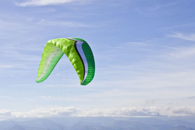 Low angle view of parachute against sky