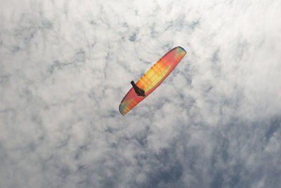 Low angle view of kite flying against sky