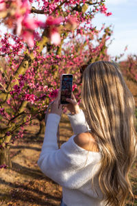 Young woman using mobile phone