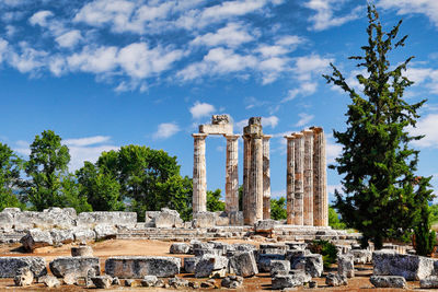 Ruins of building against cloudy sky