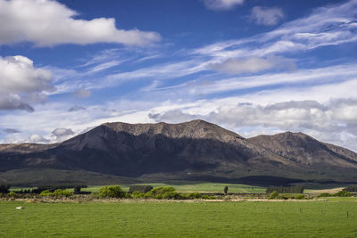 Scenic view of landscape and mountains against sky